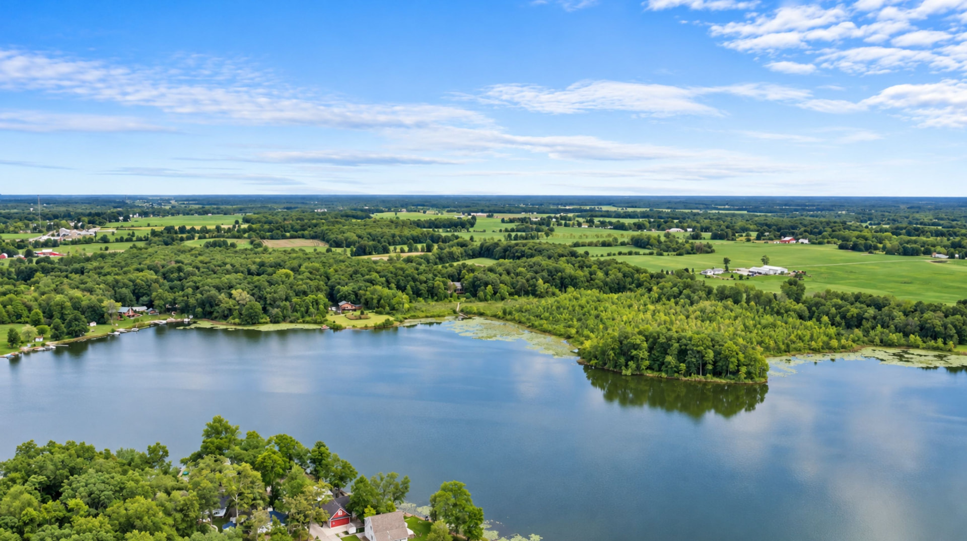 Aerial view of all-sport Little Long Lake and the surrounding acreage