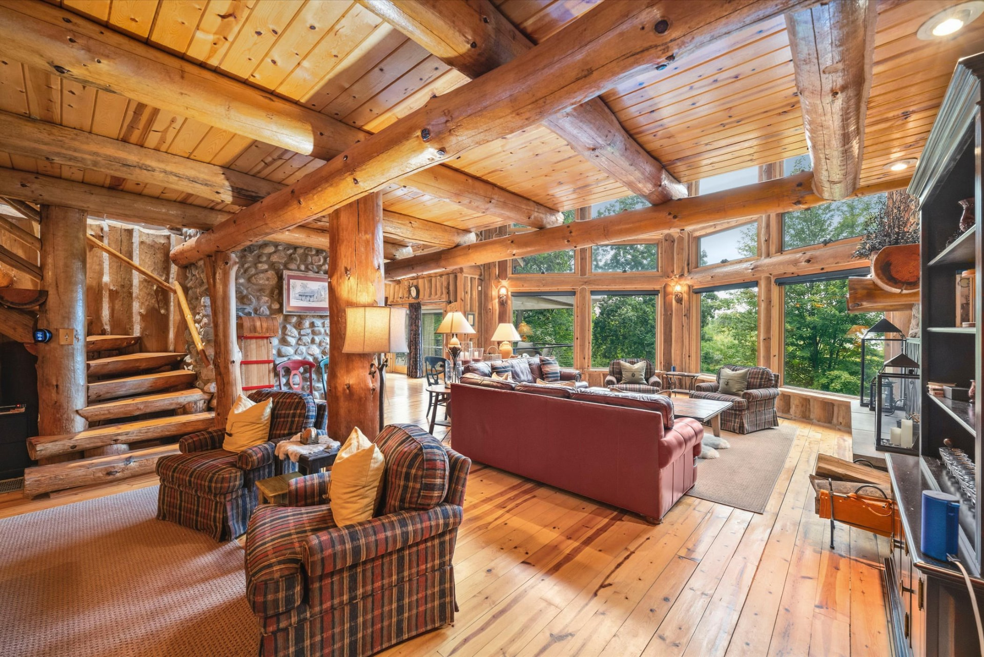 Full-log beams and columns framing the living room