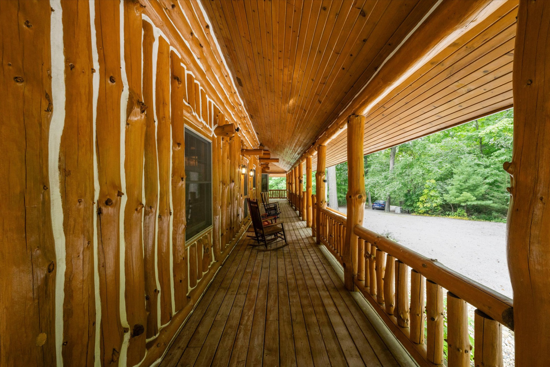 Full-length log porch with rocking chairs