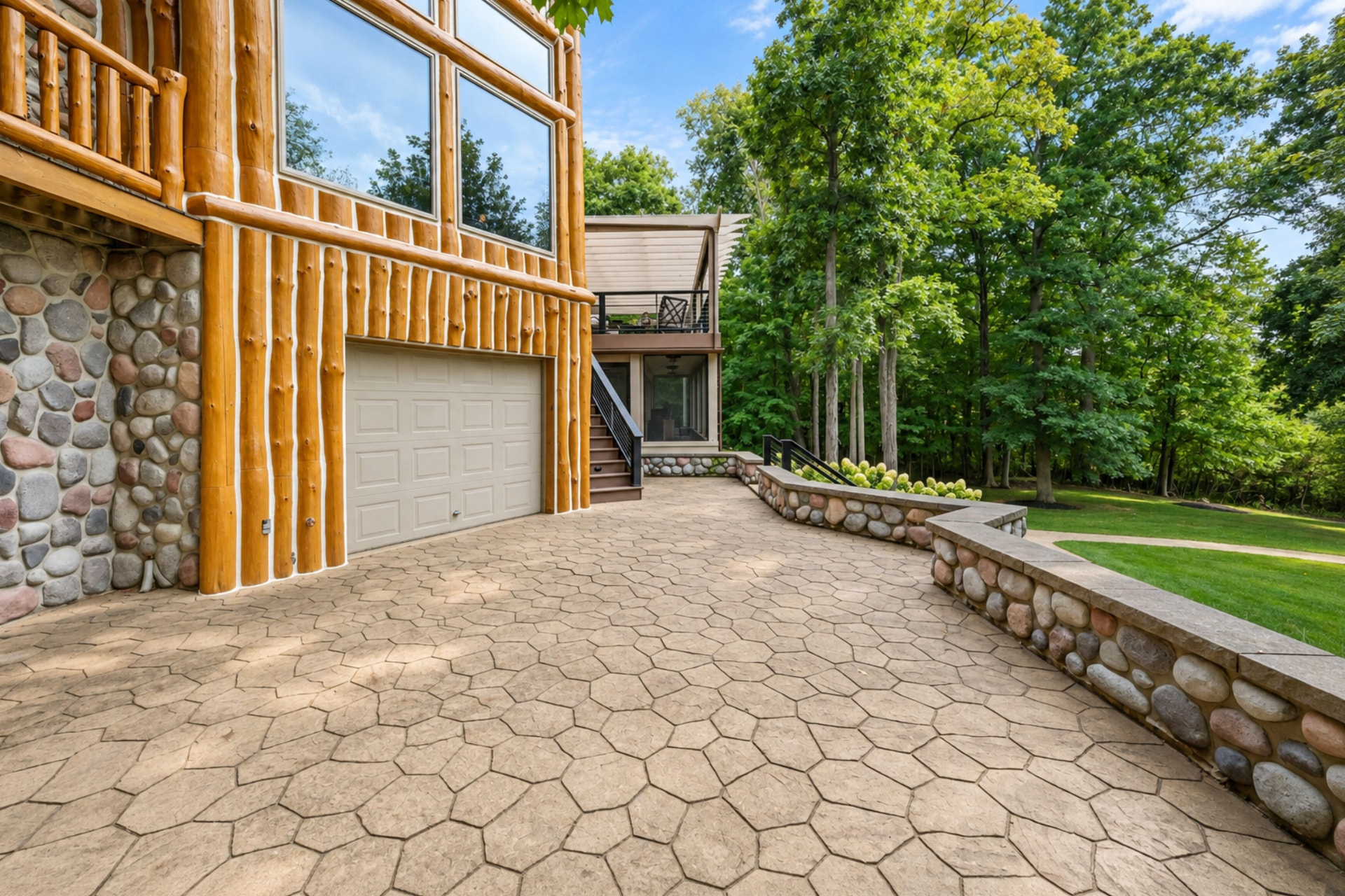 Stamped concrete patio with stone seat walls