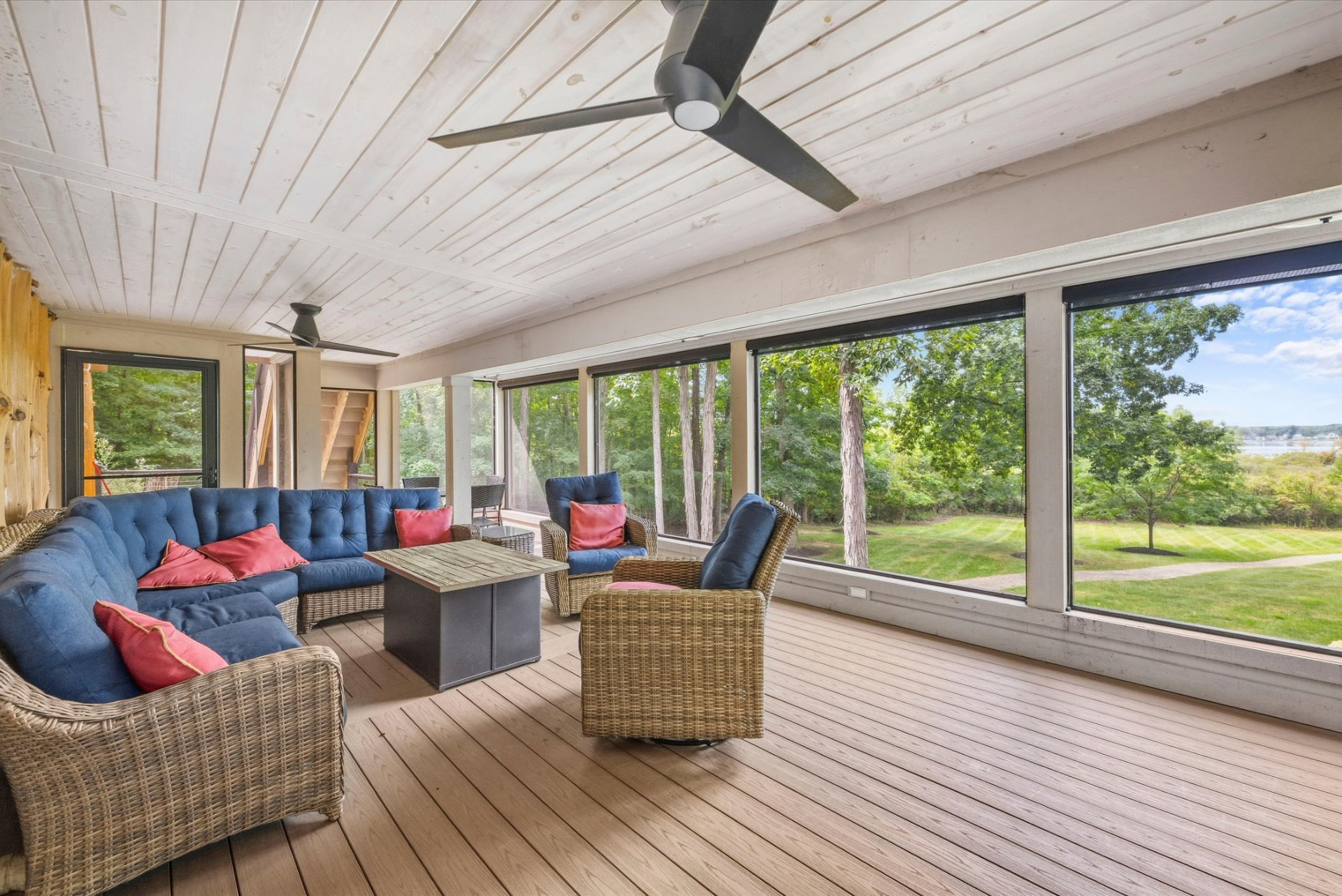 Screened porch with lake and lawn views